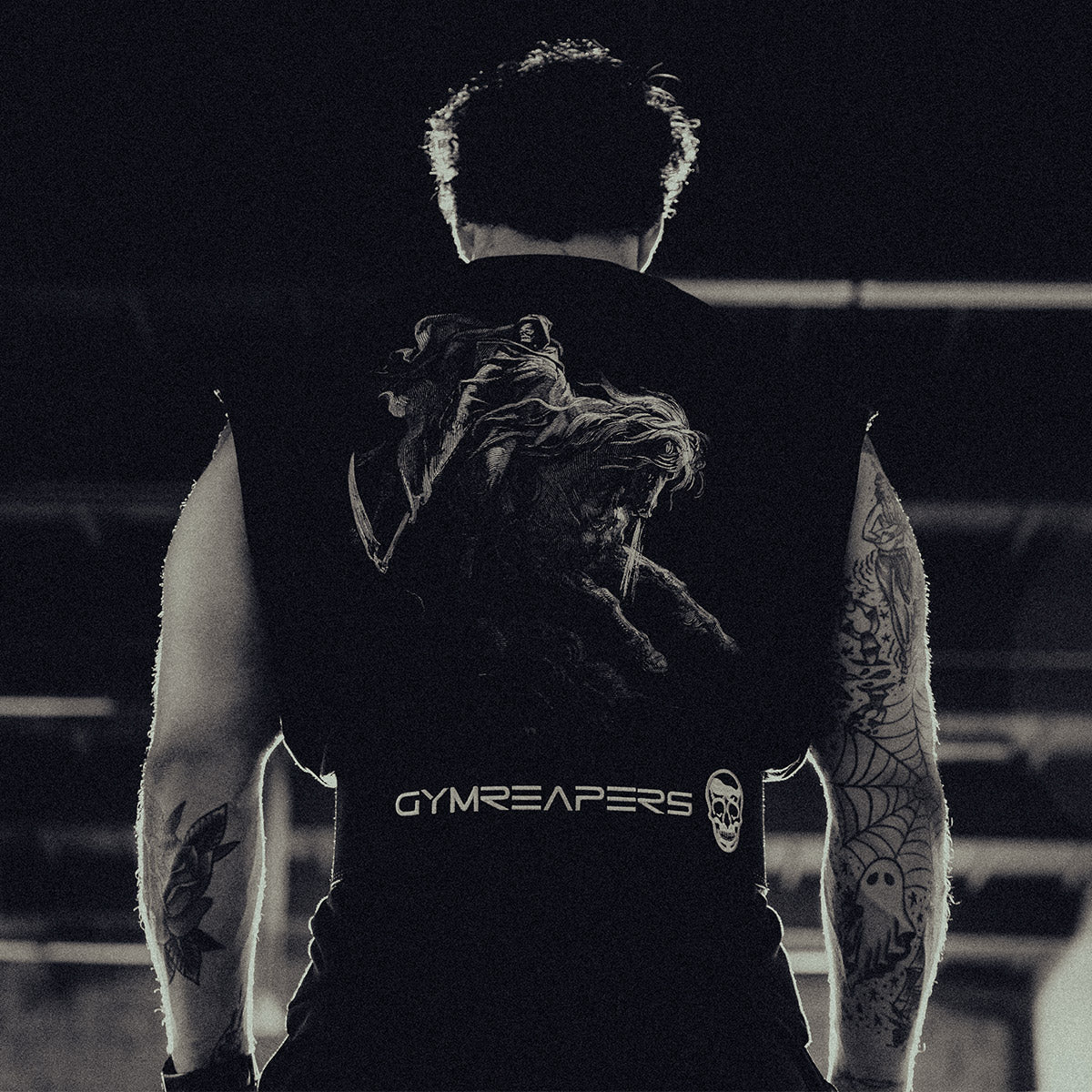 Gymreapers athlete Jack West prepares to perform a deadlift while wearing a Gymreapers lever belt and a Fourth Crusader tank top.