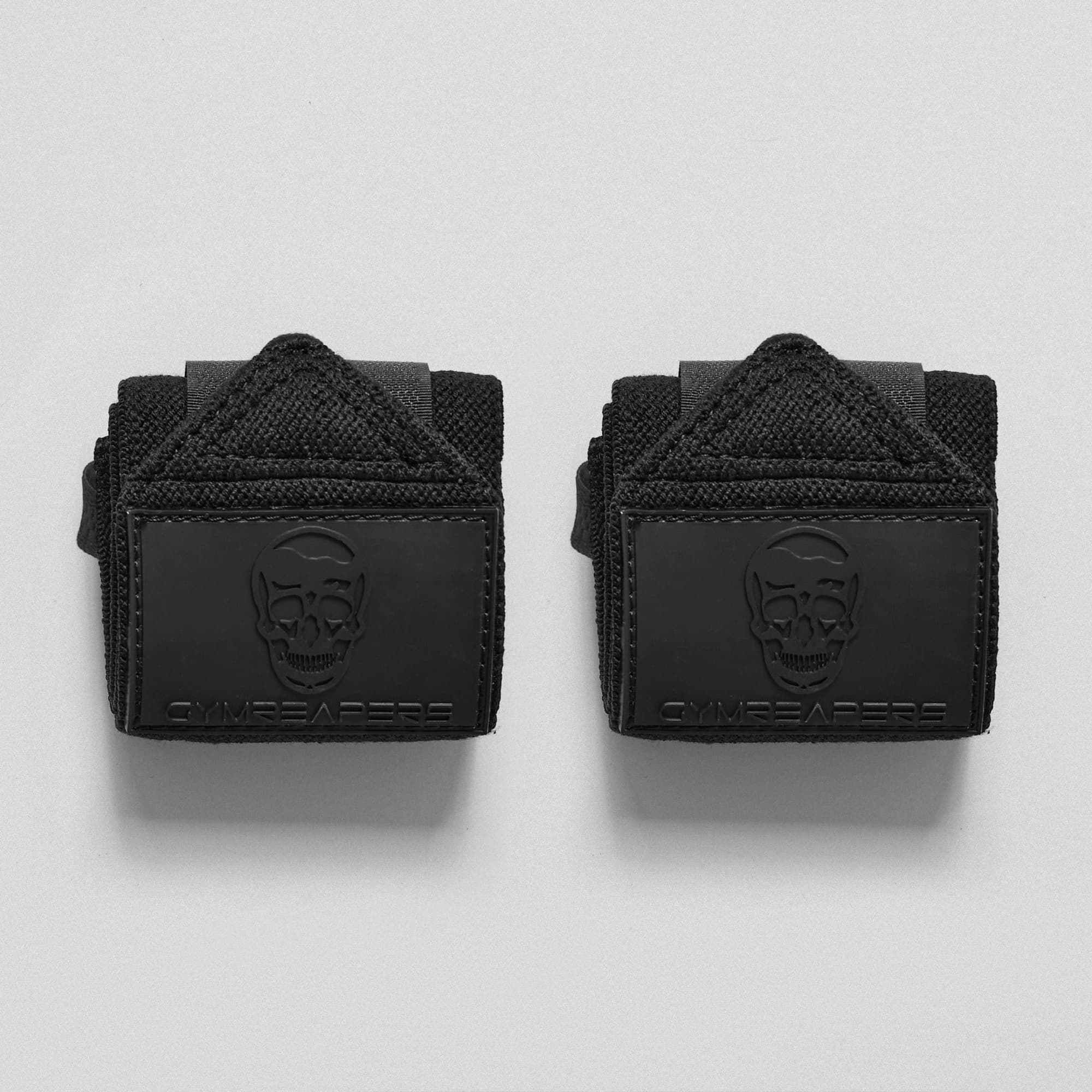 Main image for black/rubber wrist wraps on studio gray background.